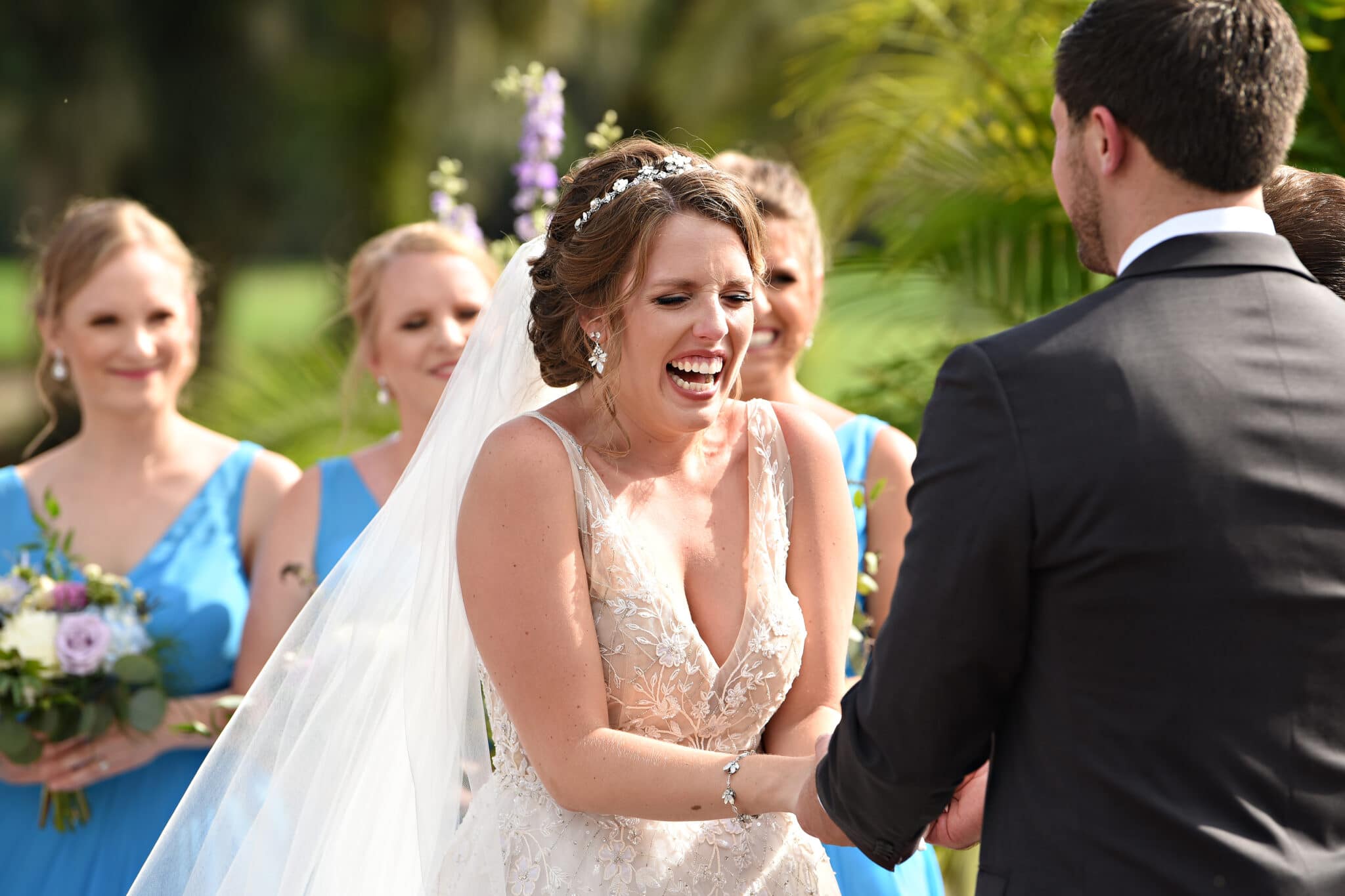 bride laughing during wedding vows at Mission Inn resort Plaza de la fontana