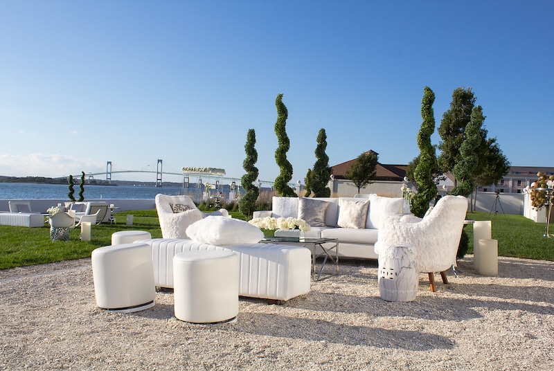 matching white furniture setup in outdoor area during wedding reception