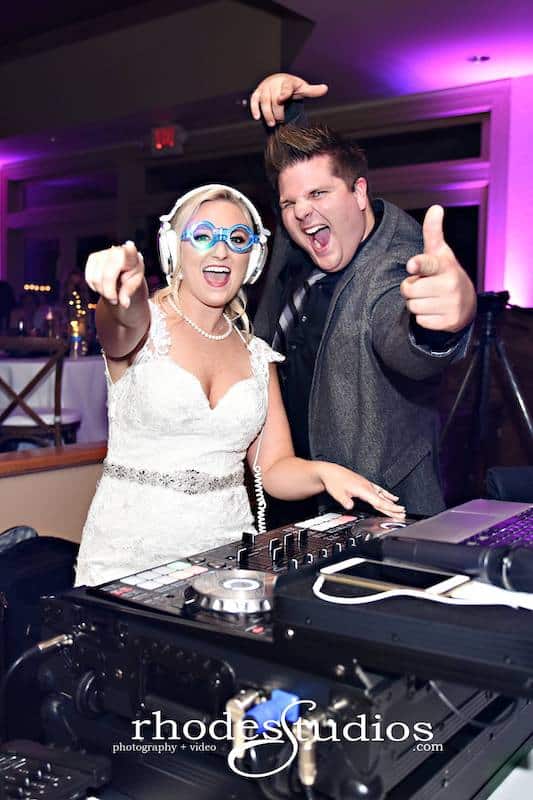 bride in fun glasses mixing songs with DJ JW