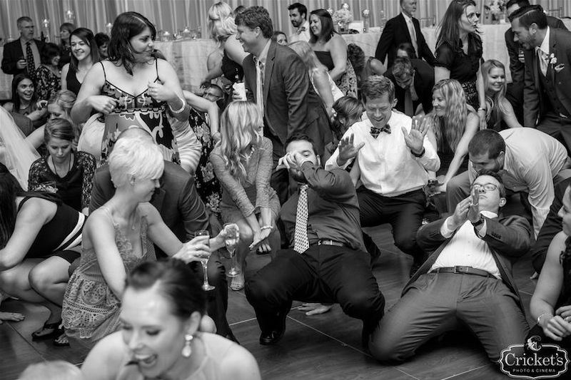 guests dancing on dance floor during wedding reception
