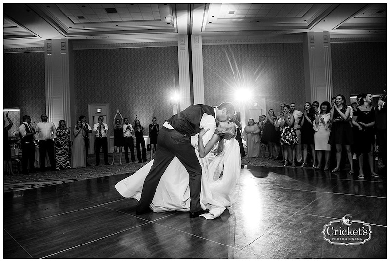 groom dipping and kissing his bride during their first dance as husband and wife