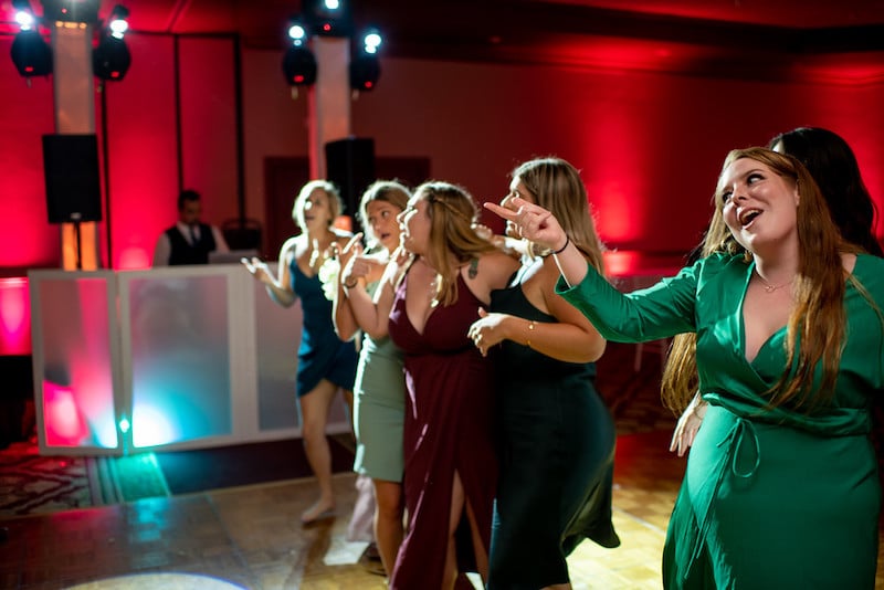 line of women dancing at wedding reception with DJ from Event Concepts Entertainment