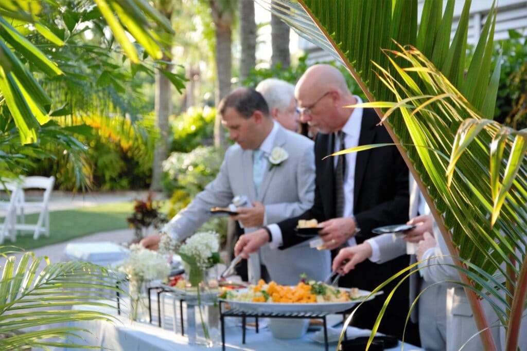 guests working down the buffet line during outdoor wedding reception