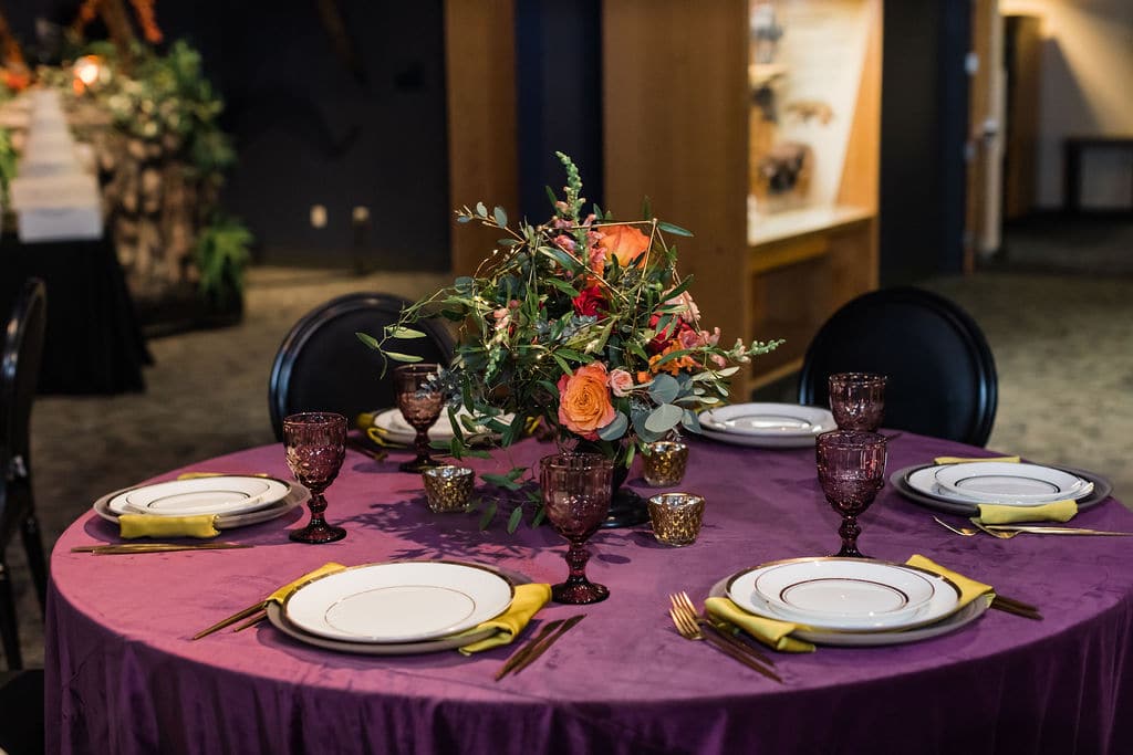 purple tablecloth & floral table setting