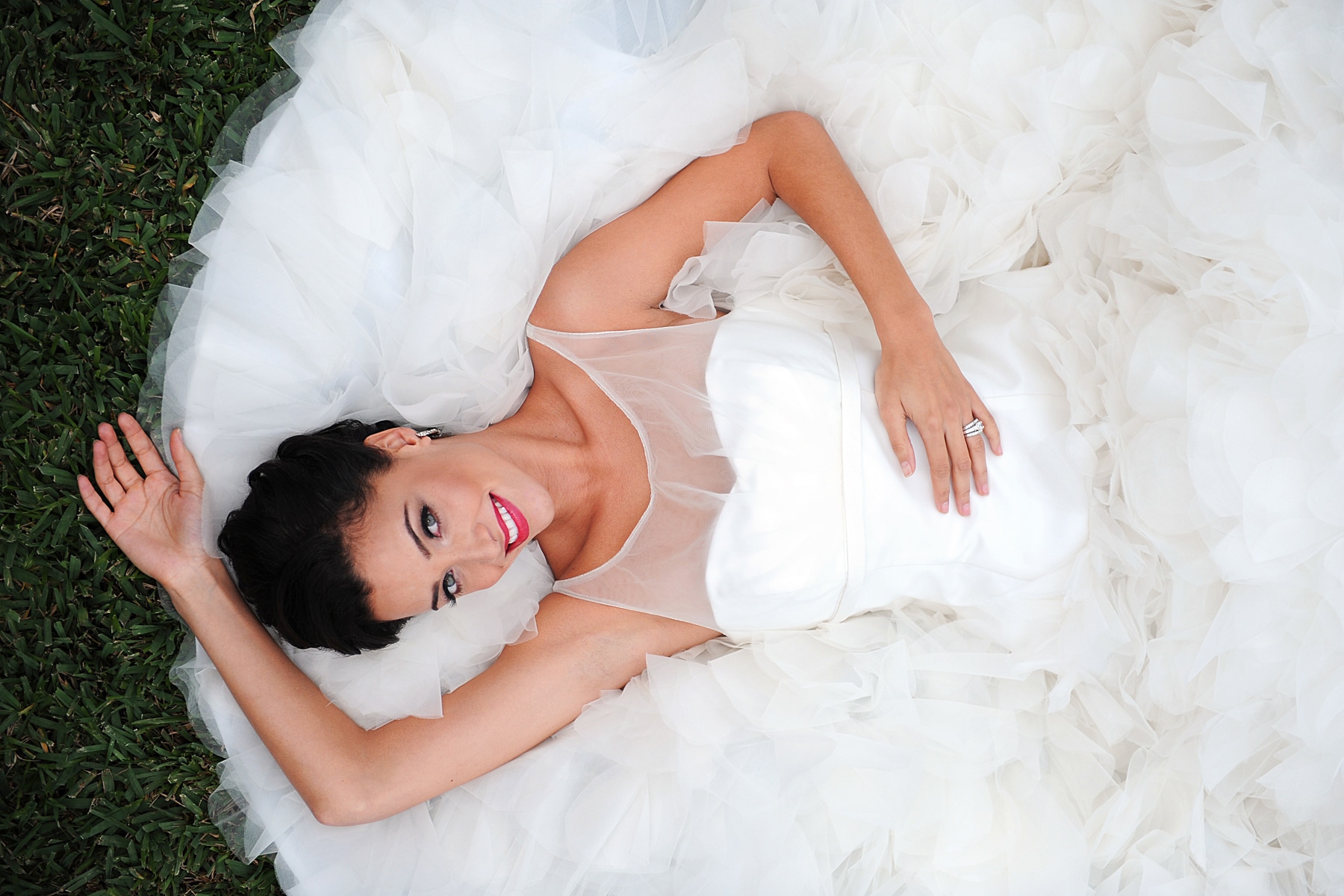 bride laying with dress around her