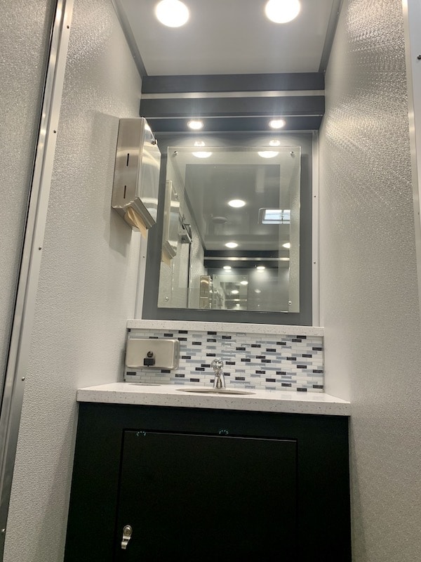 sink and mirror found inside of rented restrooms from Luxe Flush