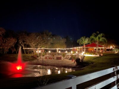 outdoor wedding venue at night with fountain and market lights at horsepower ranch florida