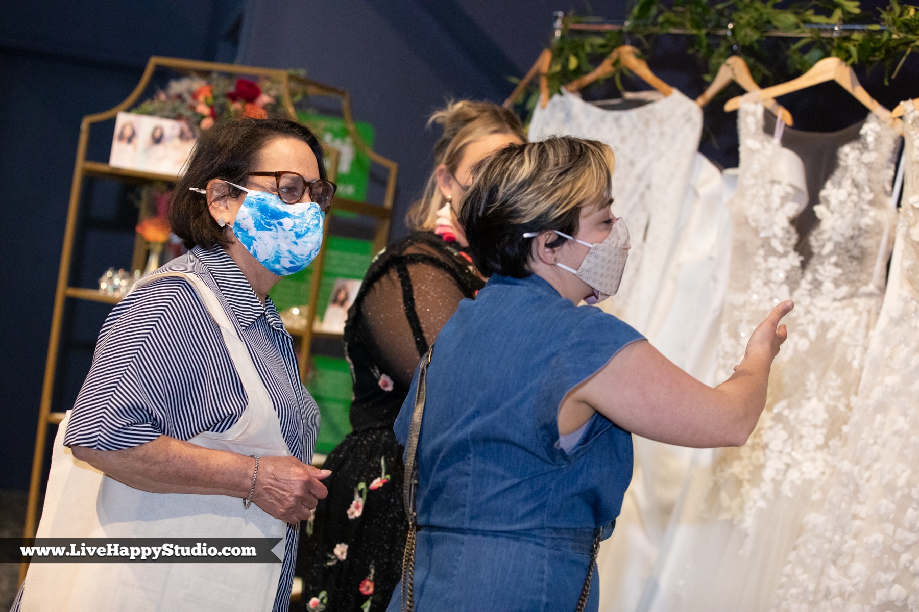 guests looking at wedding dresses