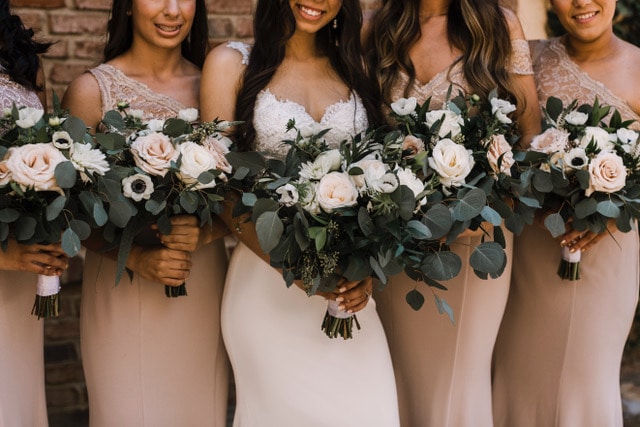 Boho and blush bride & bridesmaids with flowers 