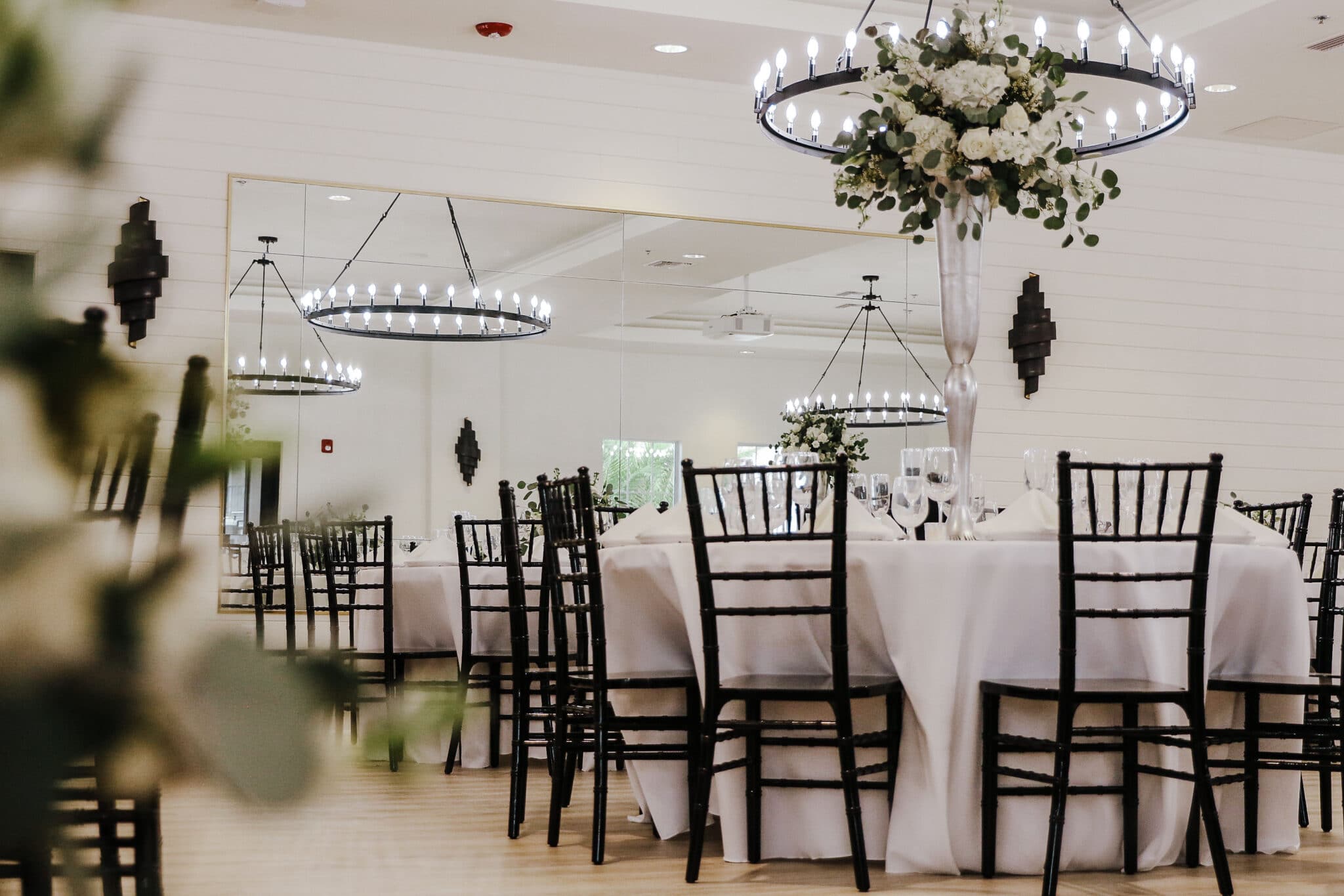 dining room with tall vases of white flowers