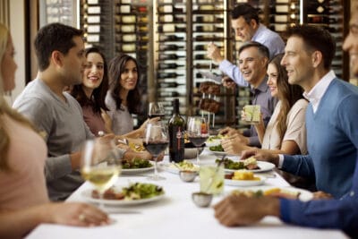 friends and family gathering for dinner and wine at Fogo de Chao