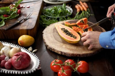 server preparing sliced fruits at Fogo de Chao
