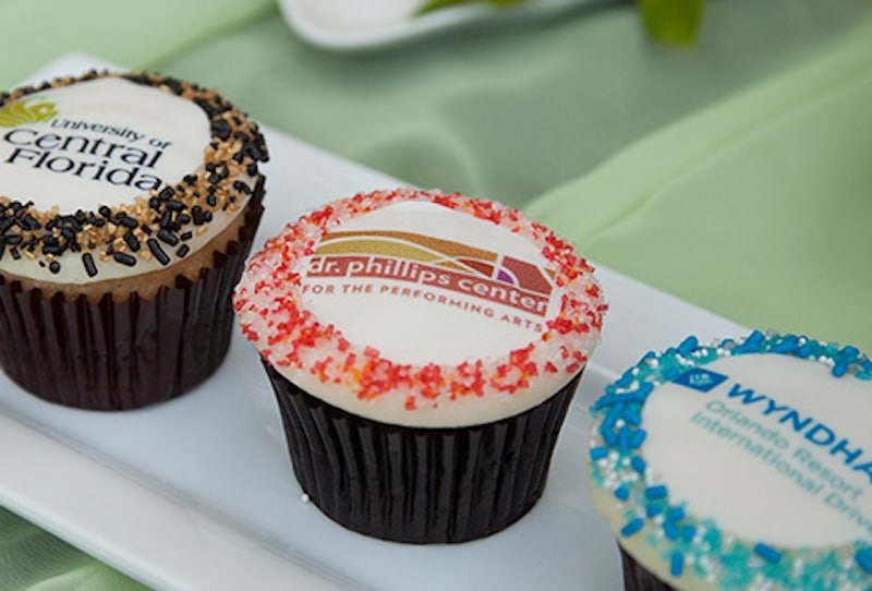 cupcakes decorated with business and organization logos