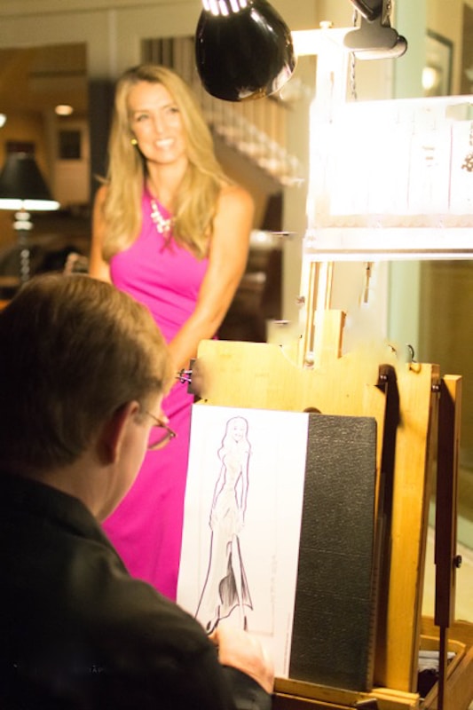 Artistic Talent Group drawing woman in pink dress modeling for a sketch