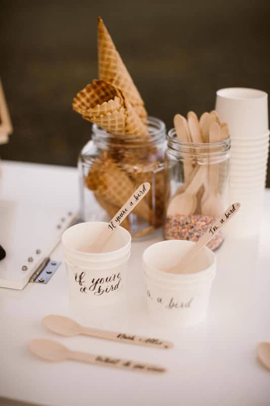 cups for serving ice cream at wedding reception with text written on the cups and spoon by Bare Lettered Calligraphy