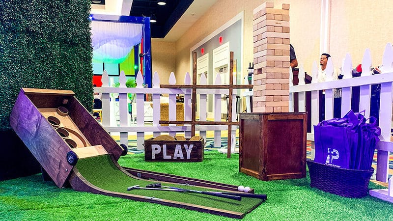play area setup for adults, with giant jenga and golf ski ball