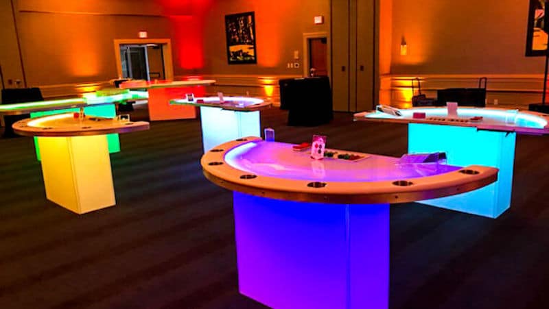 room set up to be a casino, with the tables let in multiple colors by Fun Planners