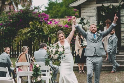 bride and groom celebrating after their wedding ceremony