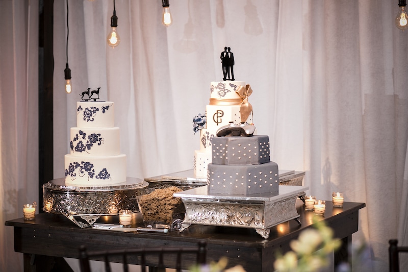 three wedding cakes displayed on a table