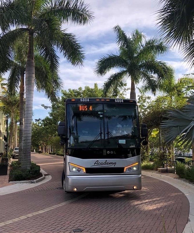 Academy Bus driving down brick road in florida