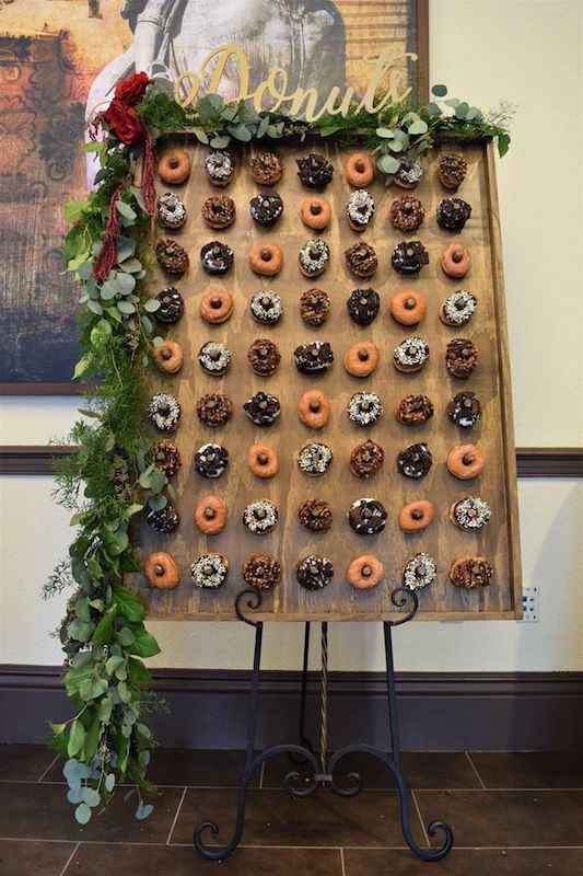 large donut wall featuring several different types of donuts from Florida Candy Buffets