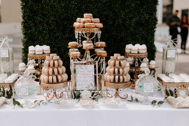dessert table from Florida Candy Buffets with macaroons, donuts, and more