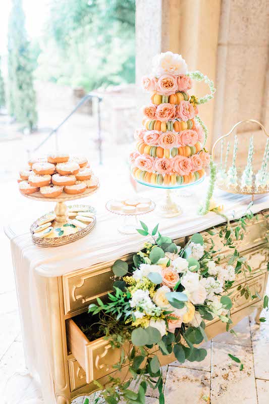 dessert table from Florida Candy Buffets with several different types of desserts including donuts and macaroons