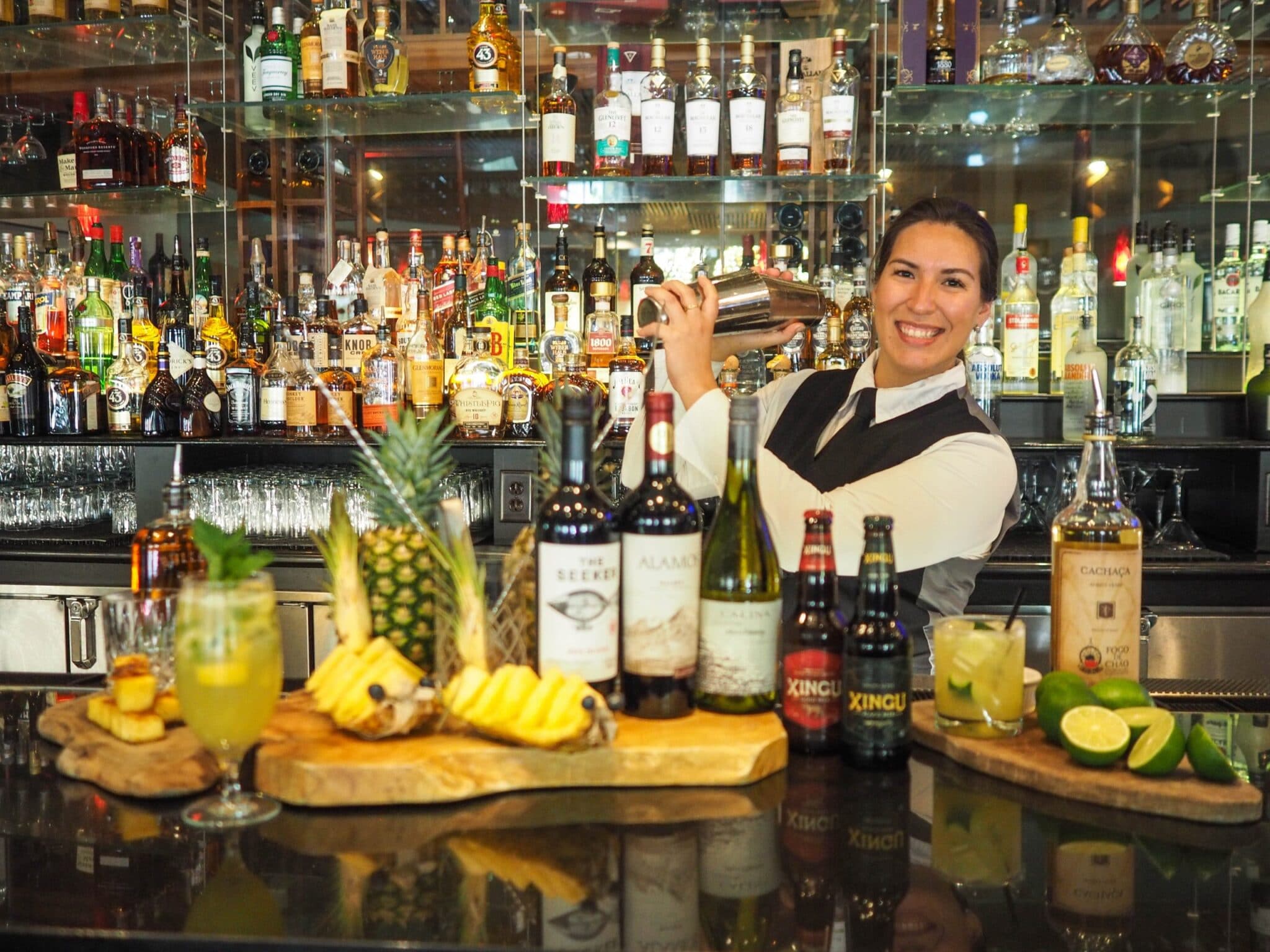 bartender with fruit and bottles