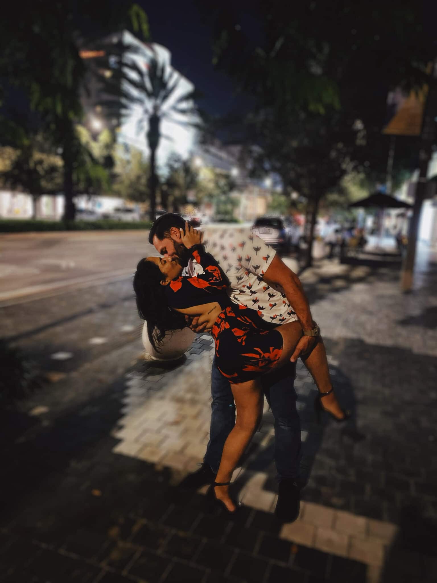 Couple dancing in the street, embracing