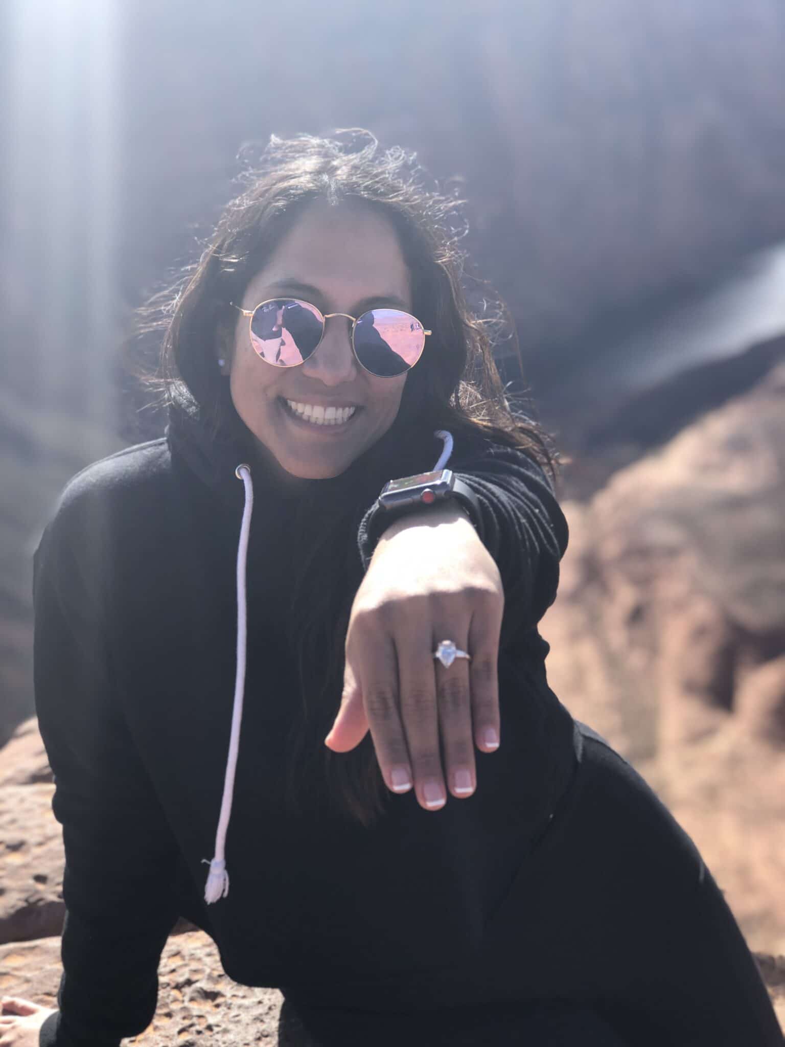 bride to be showing off her new engagement ring on her left hand after the horseshoe bend marriage proposal