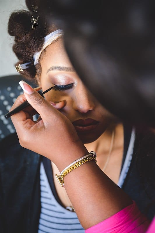 bride getting her makeup and preparing for her wedding, photo taken by Nativ Lens