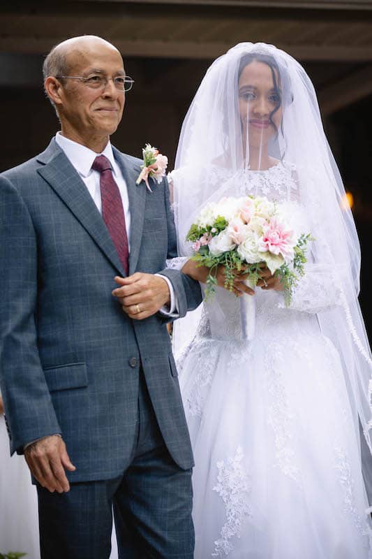 bride being escorted down the aisle by her father on her wedding day, photo taken by Nativ Lens