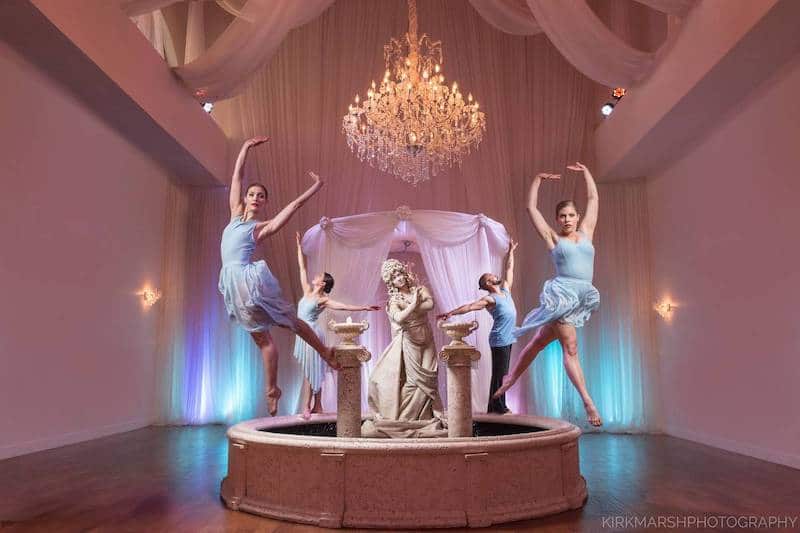 ballerinas dancing around a living fountain