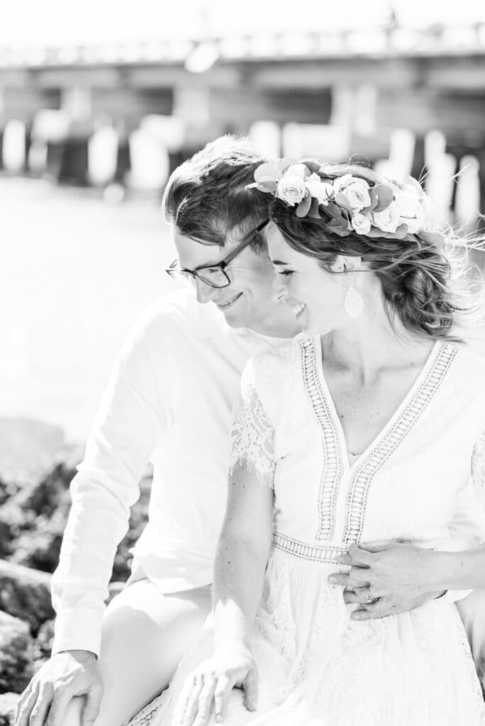 the bride and groom looking down and holding each other closr