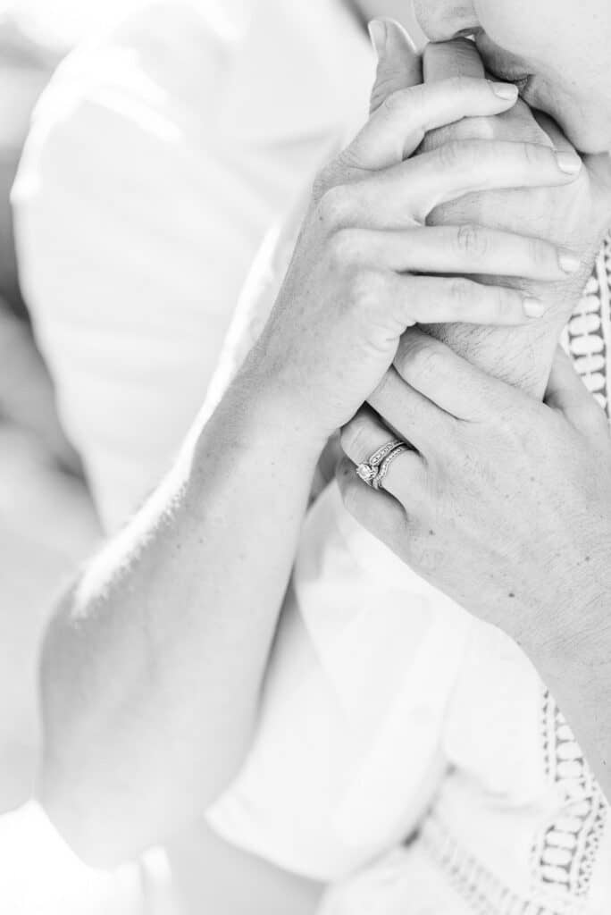 the hands of the married couple posed for the amelia island beach wedding inspiration shoot