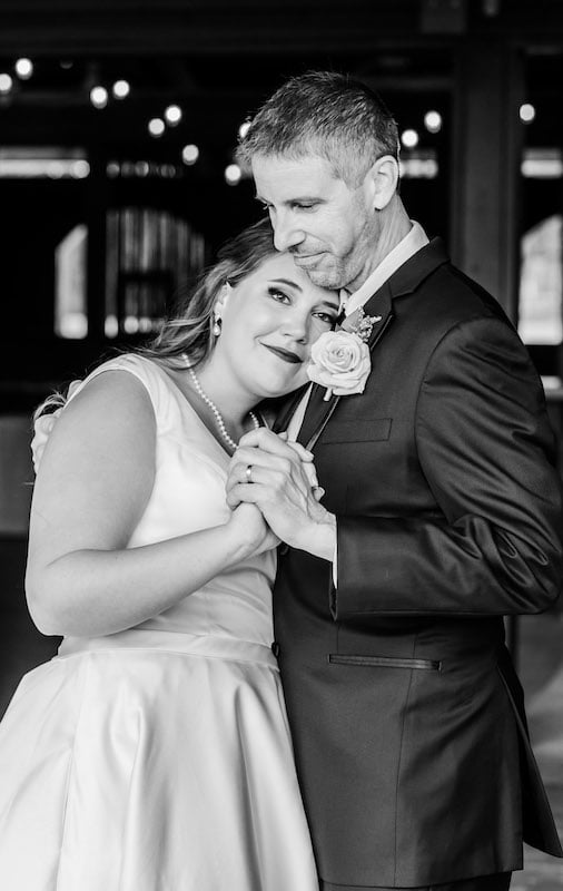 bride resting her head on her grooms chest while they dance, SMO Photography