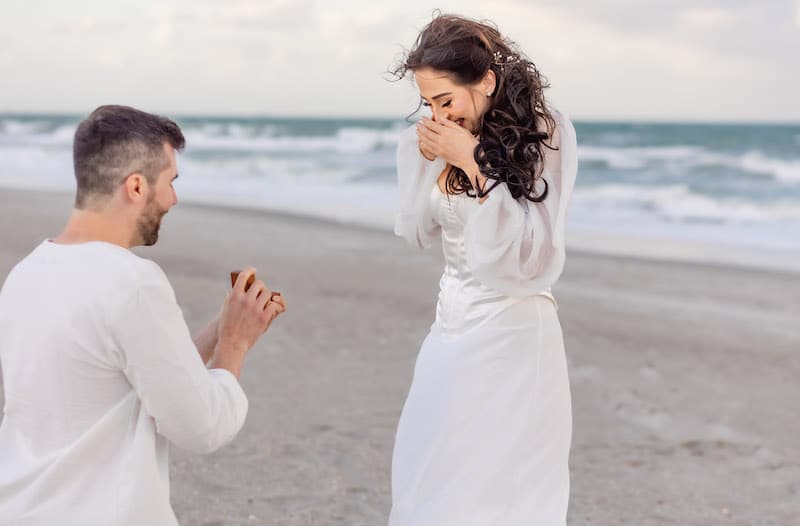 man on one knee proposing to his girlfriend on the beach, SMO Photography
