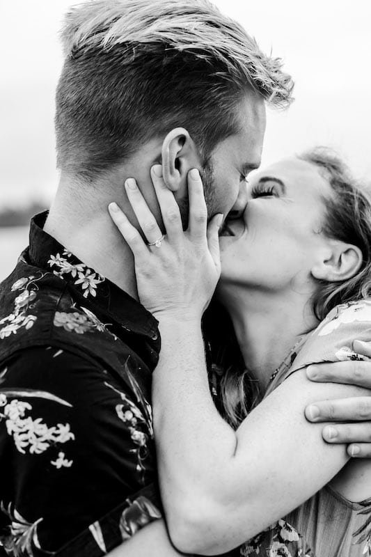 man and woman laughing and kissing after getting engaged, SMO Photography