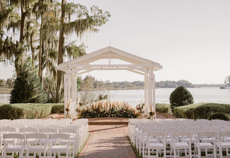 outdoor wedding ceremony area overlooking a large lake