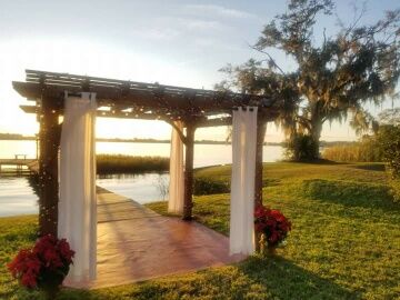 Pergola set up for wedding ceremony at The Cottage on Lake Fairview