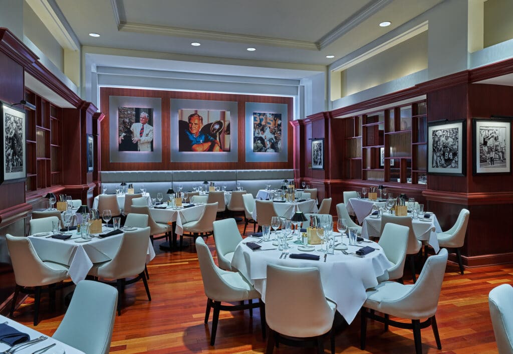 restaurant area at Walt Disney World Swan and Dolphin Resort with modern white chairs and large artwork on the walls