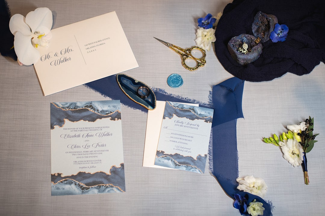the invitations and other decor for the chic geode wedding inspiration