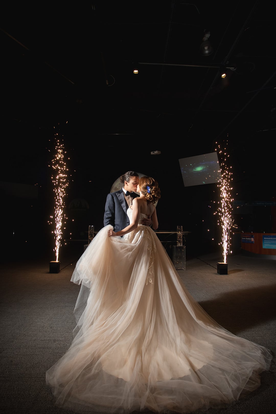 bride and groom kissing with large sparklers in the background for the chic geode wedding inspiration shoot