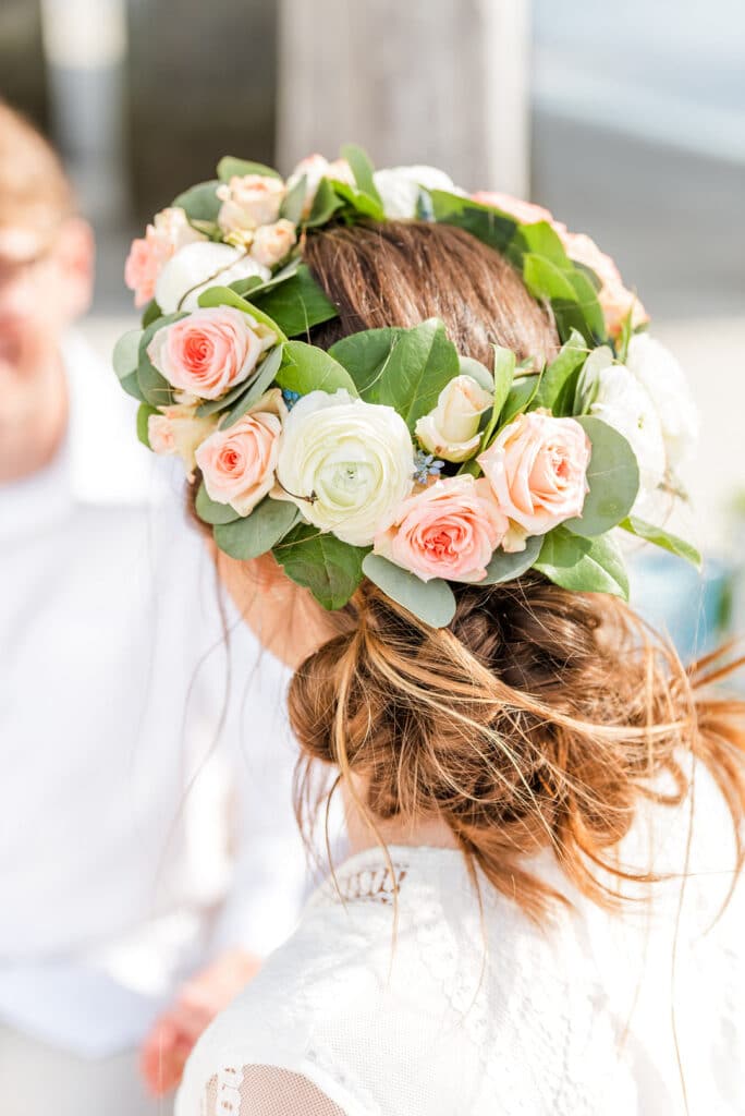 the bride's flower crown on her hair for the amelia island beach wedding inspiration shoot