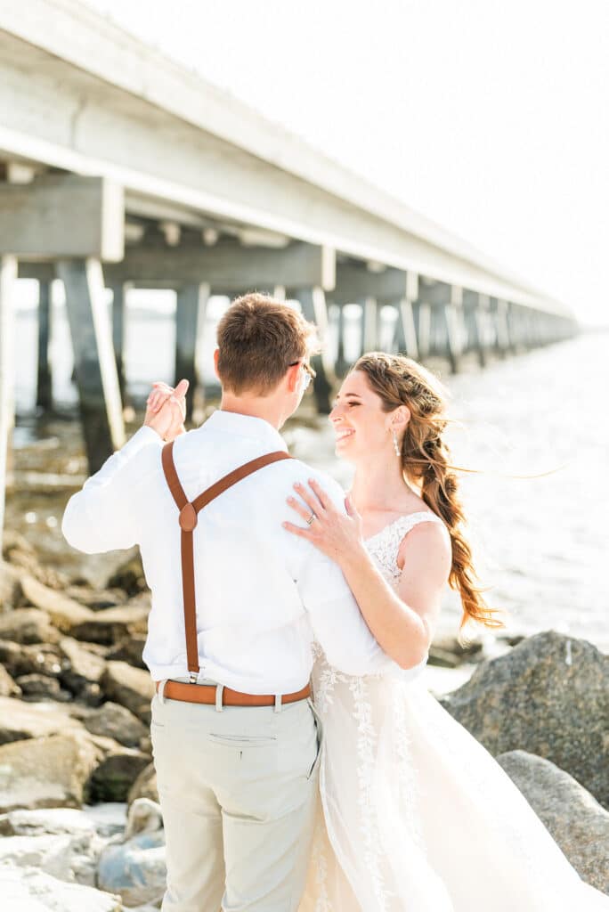 bride and groom dancing on the beach at the amelia island beach wedding inspiration shoot
