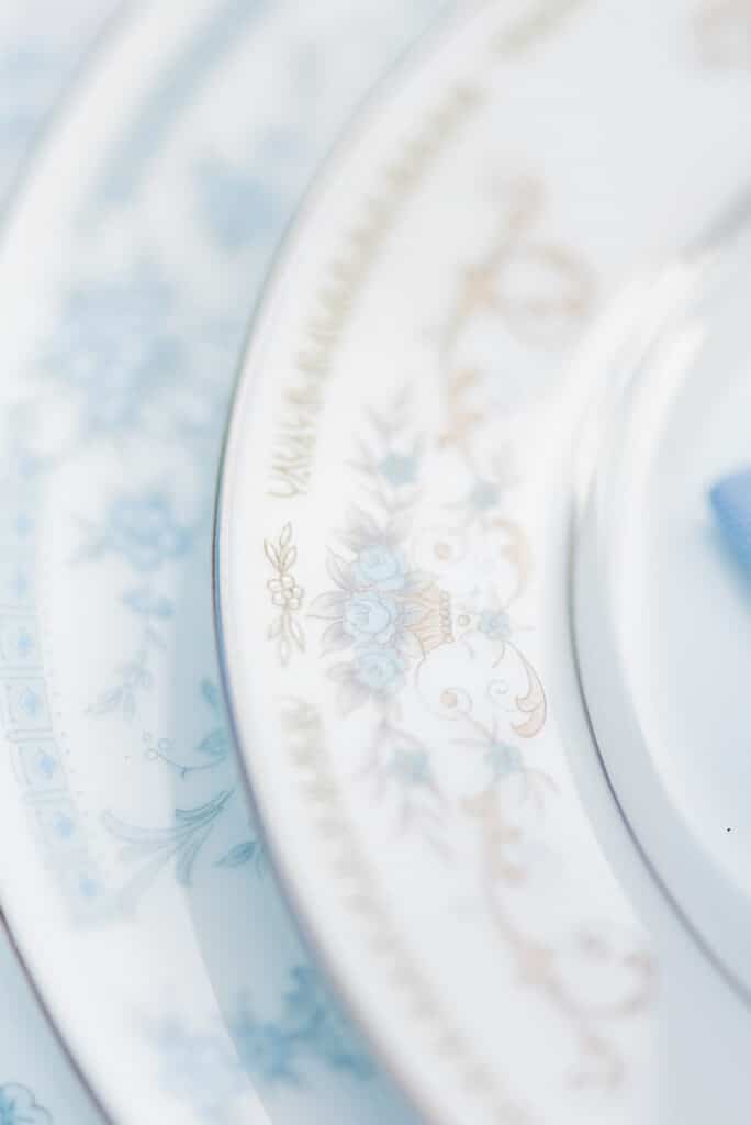 a close up of the fine china for the amelia island beach wedding inspiration shoot