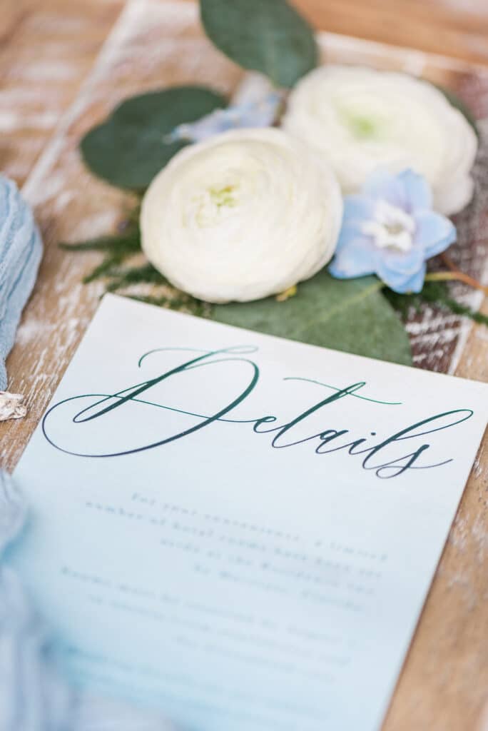 the details portion of the invitation to the amelia island wedding inspiration shoot