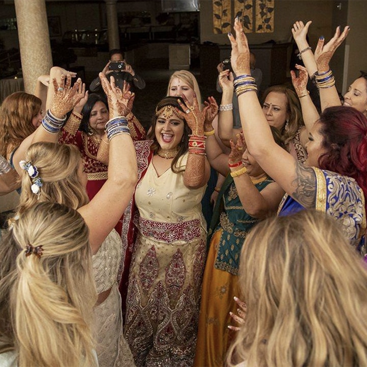 Women dancing around the bride at a wedding