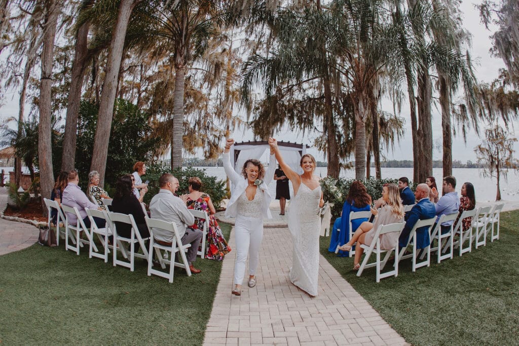 Brides celebrating walking down the aisle