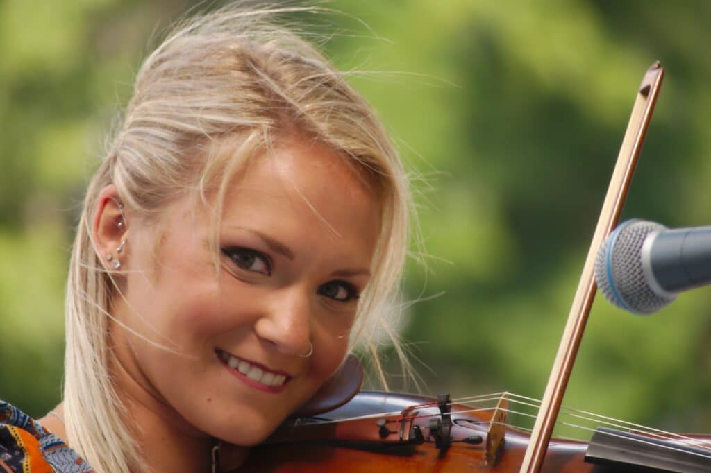 Close up of a female musician playing the violin.